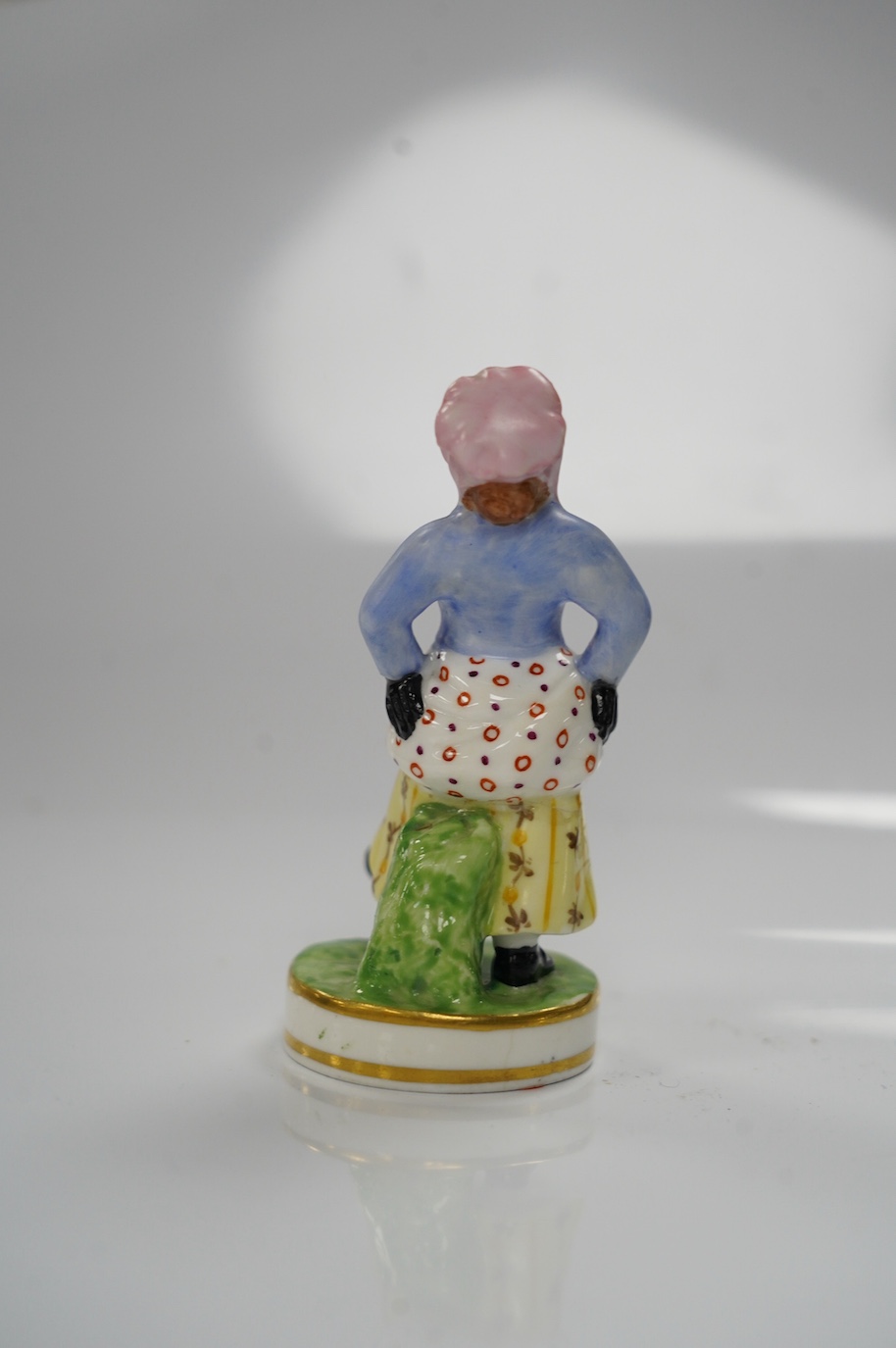 A Derby (Sampson Hancock) porcelain Figurine, 'African Sall', 9cm. Condition - good